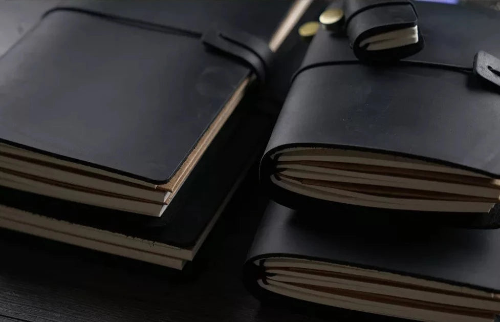 Black cover leather notebooks . Black Travelers notebook