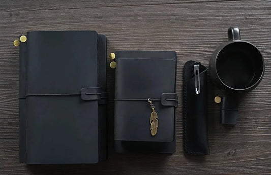 Black cover leather notebooks . Black Travelers notebook